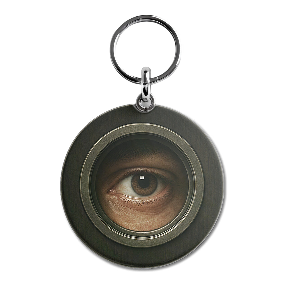 3D-Schlüsselanhänger mit einem geöffneten Auge.